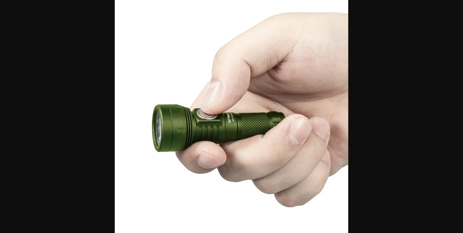 Lumintop GT Nano Pro in hand — showing the compact 79mm body, side switch, and LED head; green colorway with keychain-friendly proportions.